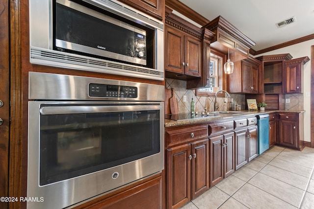 kitchen featuring crown molding, sink, light tile patterned floors, tasteful backsplash, and stainless steel appliances