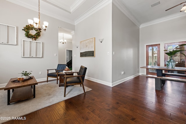 sitting room featuring crown molding, dark hardwood / wood-style floors, and a towering ceiling