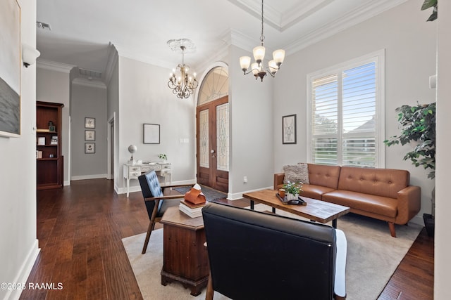 living room featuring ornamental molding, dark wood-type flooring, a chandelier, and french doors