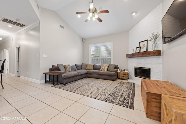 tiled living room featuring ornamental molding, lofted ceiling, ceiling fan, and a fireplace