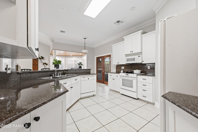 kitchen with sink, white cabinets, hanging light fixtures, ornamental molding, and white appliances