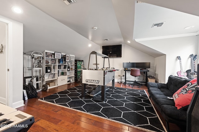 interior space with lofted ceiling and hardwood / wood-style floors