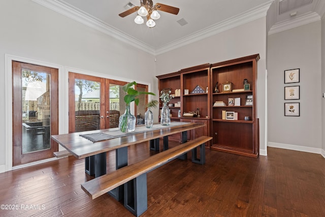 dining room featuring dark hardwood / wood-style floors, ornamental molding, french doors, and ceiling fan