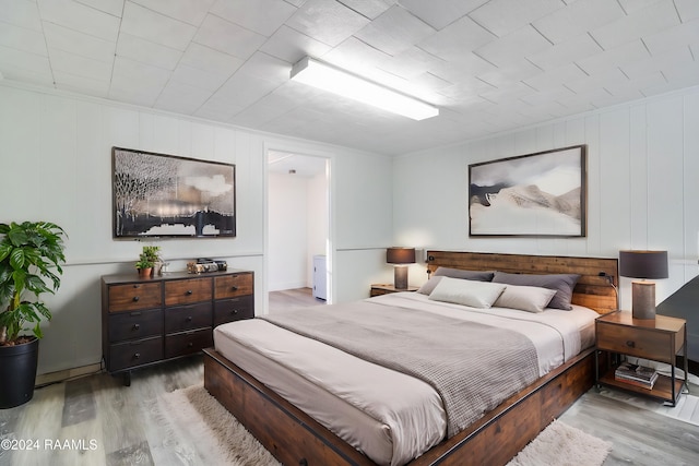 bedroom with light hardwood / wood-style flooring