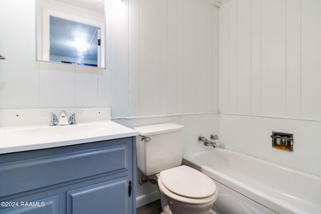 bathroom with vanity, toilet, and a tub