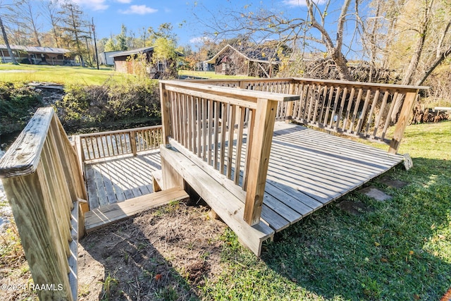 wooden deck with a yard