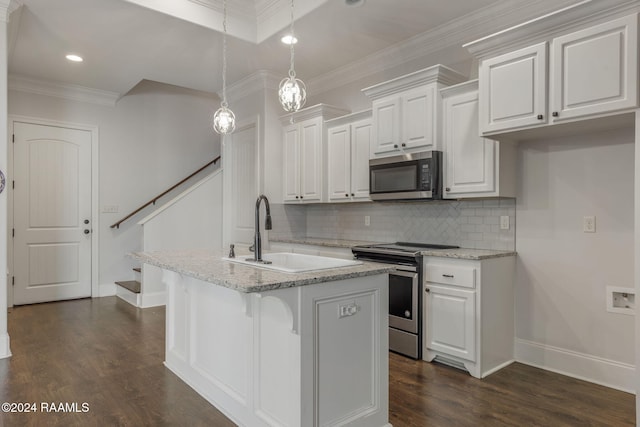 kitchen featuring sink, white cabinetry, stainless steel appliances, and a kitchen island with sink