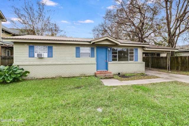 single story home featuring cooling unit and a front yard