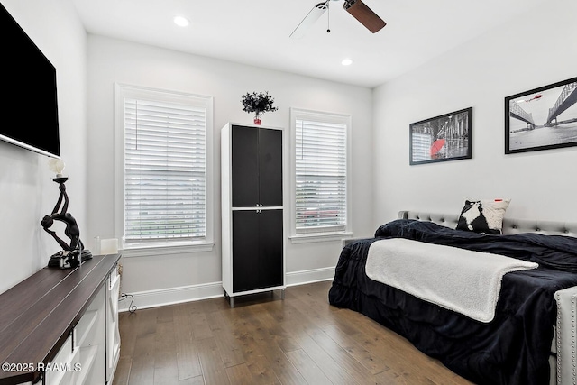 bedroom featuring ceiling fan and dark hardwood / wood-style floors