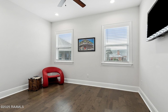 unfurnished room with ceiling fan and dark hardwood / wood-style flooring