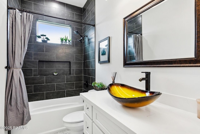 full bathroom featuring toilet, vanity, and shower / bathtub combination with curtain