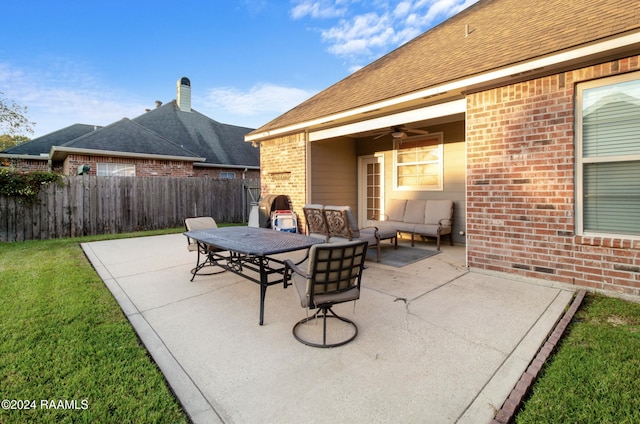 view of patio with outdoor lounge area and ceiling fan