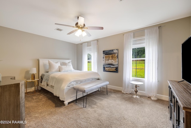 bedroom with ceiling fan and carpet floors