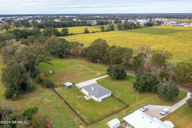 birds eye view of property with a rural view