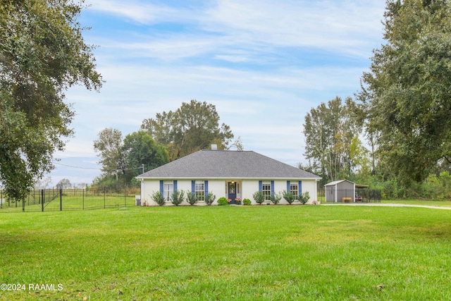 ranch-style home featuring a front lawn