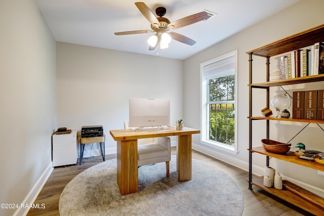 office space featuring ceiling fan and hardwood / wood-style flooring