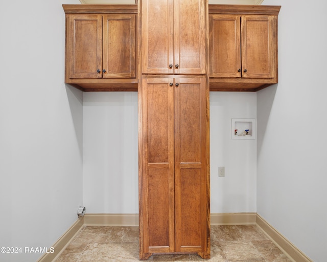 laundry room with cabinets and washer hookup