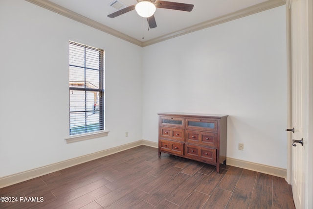 empty room featuring ceiling fan, dark hardwood / wood-style flooring, and crown molding