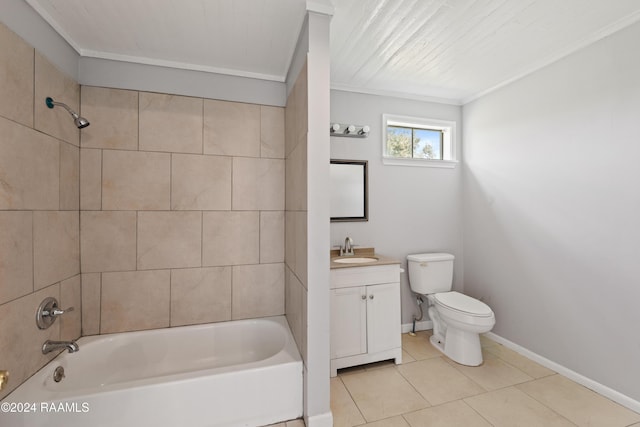 full bathroom featuring tiled shower / bath, tile patterned flooring, ornamental molding, vanity, and toilet