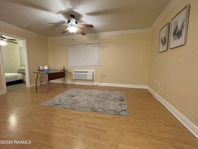 interior space with a wall mounted AC, hardwood / wood-style flooring, and ornamental molding