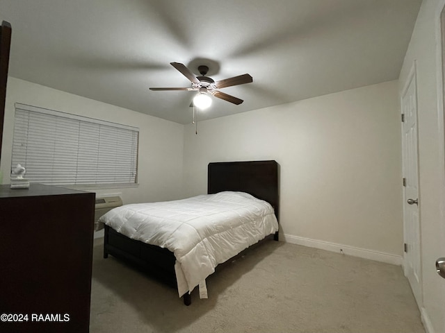 bedroom with ceiling fan and light colored carpet