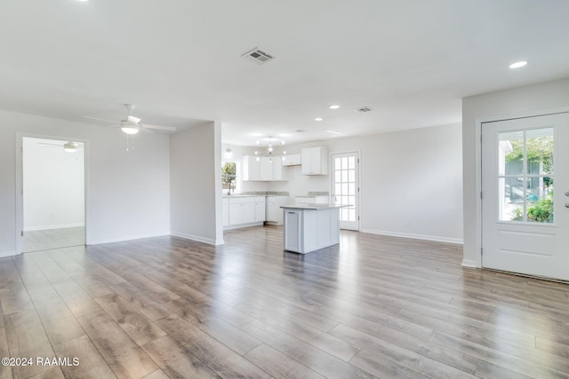 unfurnished living room with ceiling fan and light hardwood / wood-style floors