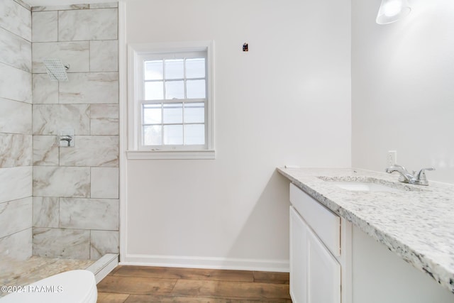 120 Oak Crest Dr, Lafayette, LA 70503 - full bath featuring vanity, tiled shower, and wood finished floors