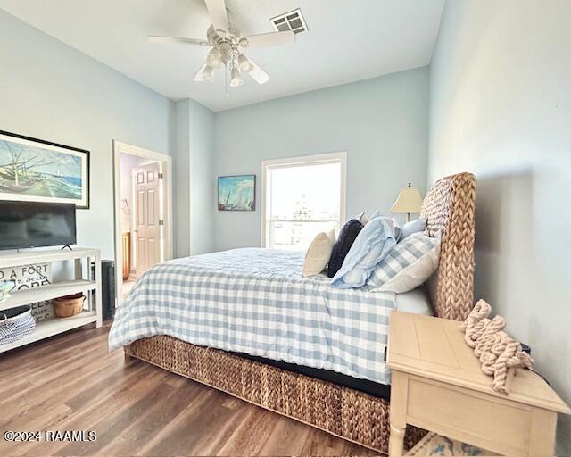 bedroom featuring ceiling fan and hardwood / wood-style floors