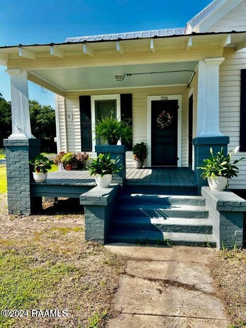 entrance to property with a porch