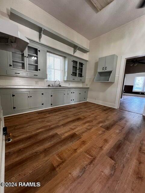 kitchen with dark hardwood / wood-style flooring, a textured ceiling, and sink