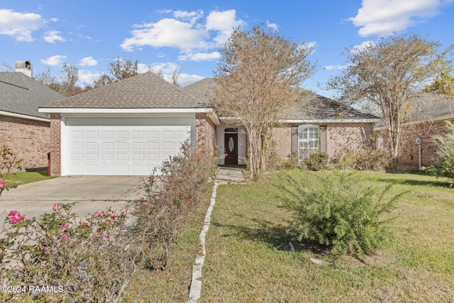 ranch-style house with a garage and a front lawn