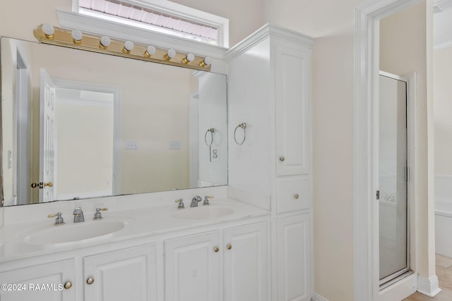 bathroom featuring vanity and walk in shower