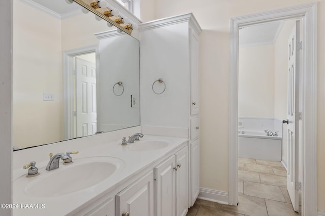 bathroom with a bathing tub, vanity, crown molding, and tile patterned floors