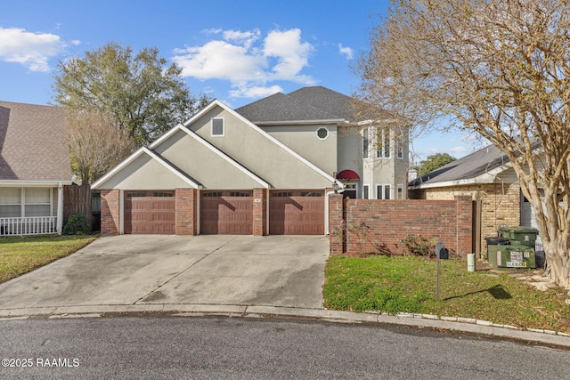 front facade with a front yard and a garage