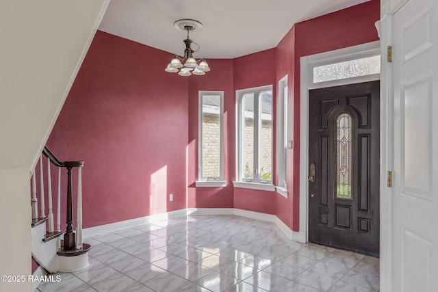 entryway with an inviting chandelier