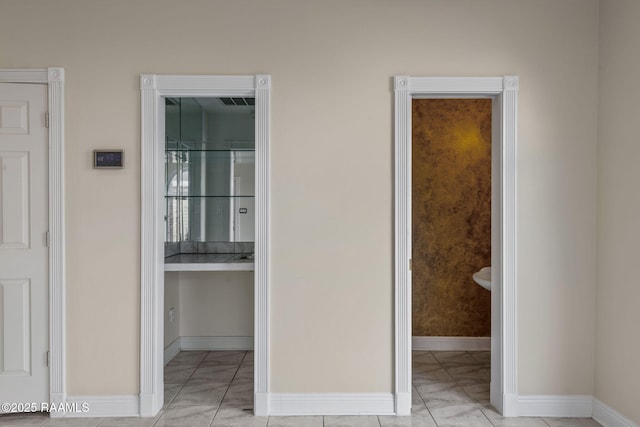 hall with light tile patterned floors