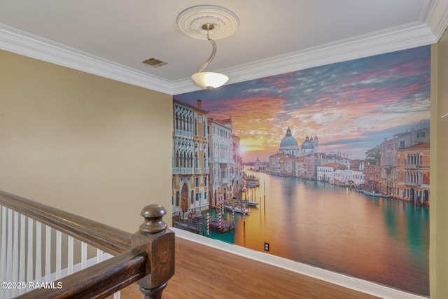 interior space featuring a water view, ornamental molding, and hardwood / wood-style floors