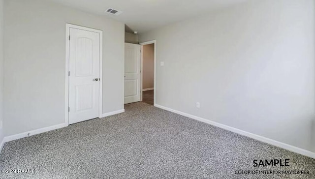 unfurnished bedroom with carpet flooring