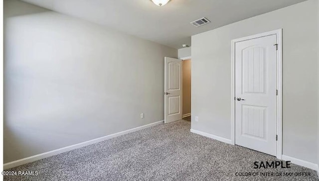 unfurnished bedroom with carpet