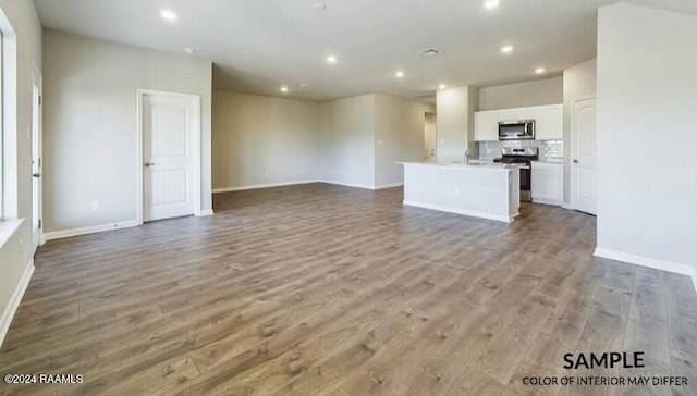 unfurnished living room with light wood-type flooring