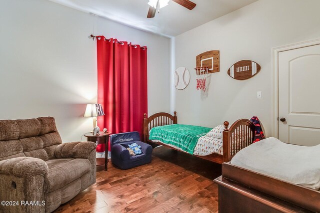 bedroom featuring ceiling fan and wood-type flooring