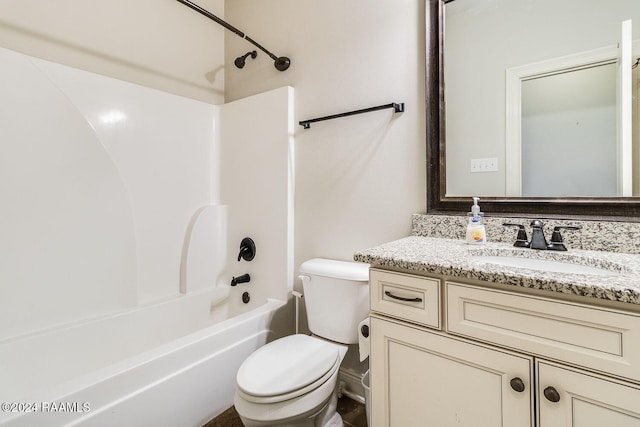 full bathroom featuring vanity, bathtub / shower combination, and toilet