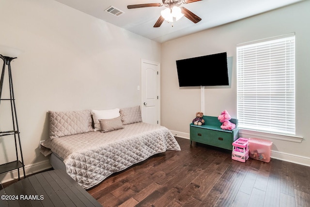 bedroom with ceiling fan and dark wood-type flooring