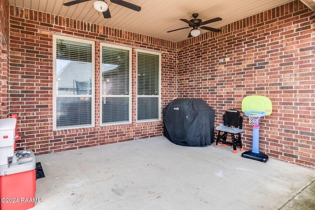 view of patio / terrace with area for grilling and ceiling fan