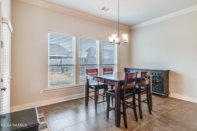 dining area with crown molding and a notable chandelier