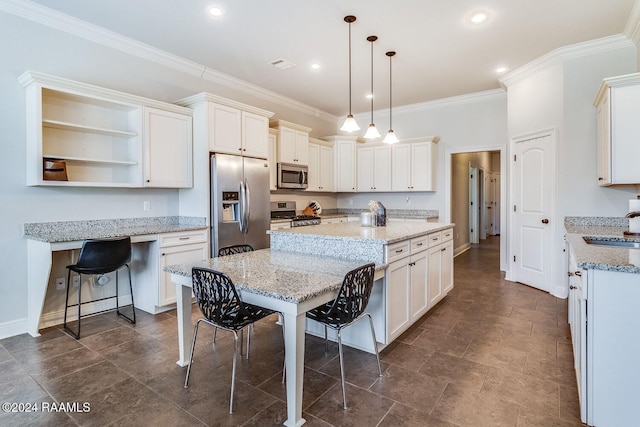 kitchen with hanging light fixtures, stainless steel appliances, a kitchen breakfast bar, light stone counters, and white cabinets