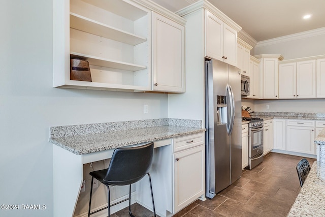 kitchen featuring light stone countertops, a breakfast bar, stainless steel appliances, and crown molding