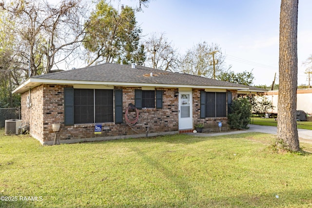 single story home featuring a front yard and central AC