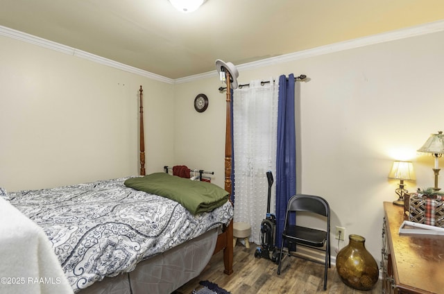 bedroom featuring wood-type flooring and crown molding