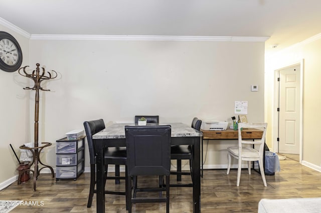 dining room featuring dark hardwood / wood-style floors and ornamental molding